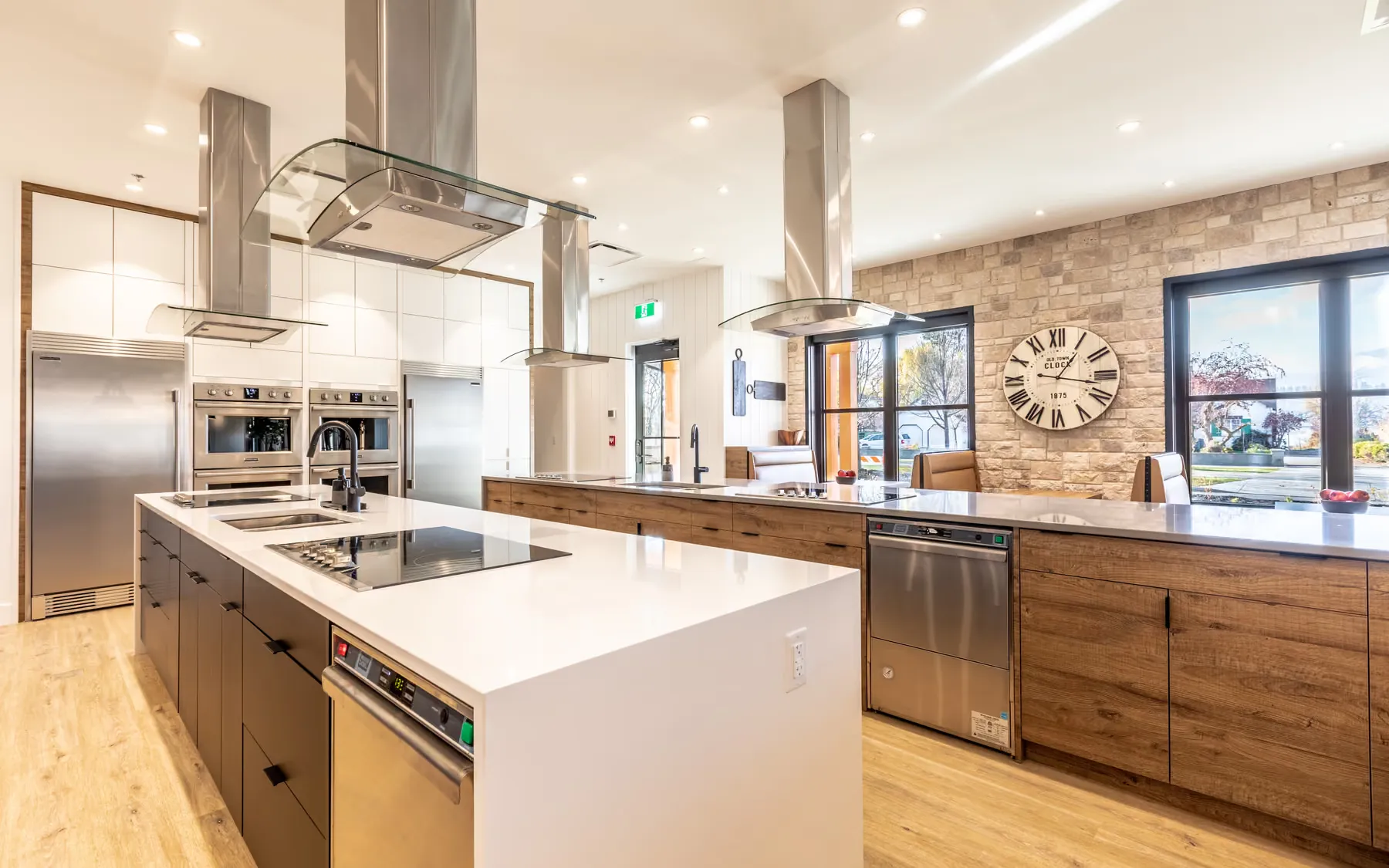 JoeAnna's House island detail with an induction cooktop and warm wood cabinet fronts