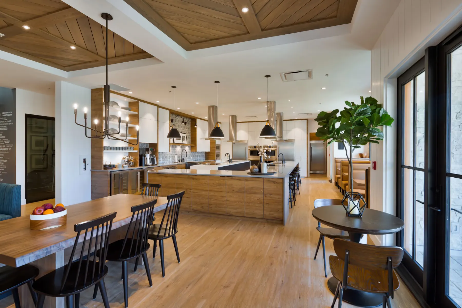 Communal kitchen at JoeAnna's House with twin islands and stainless range hoods
