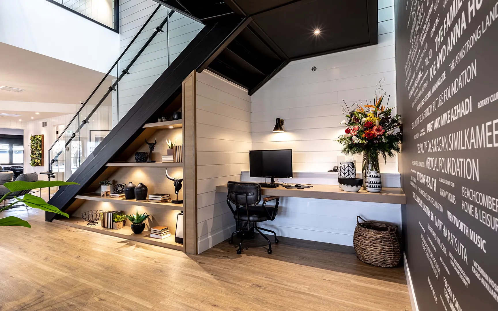 JoeAnna's House office nook with a built-in desk and shelving beside the donor wall