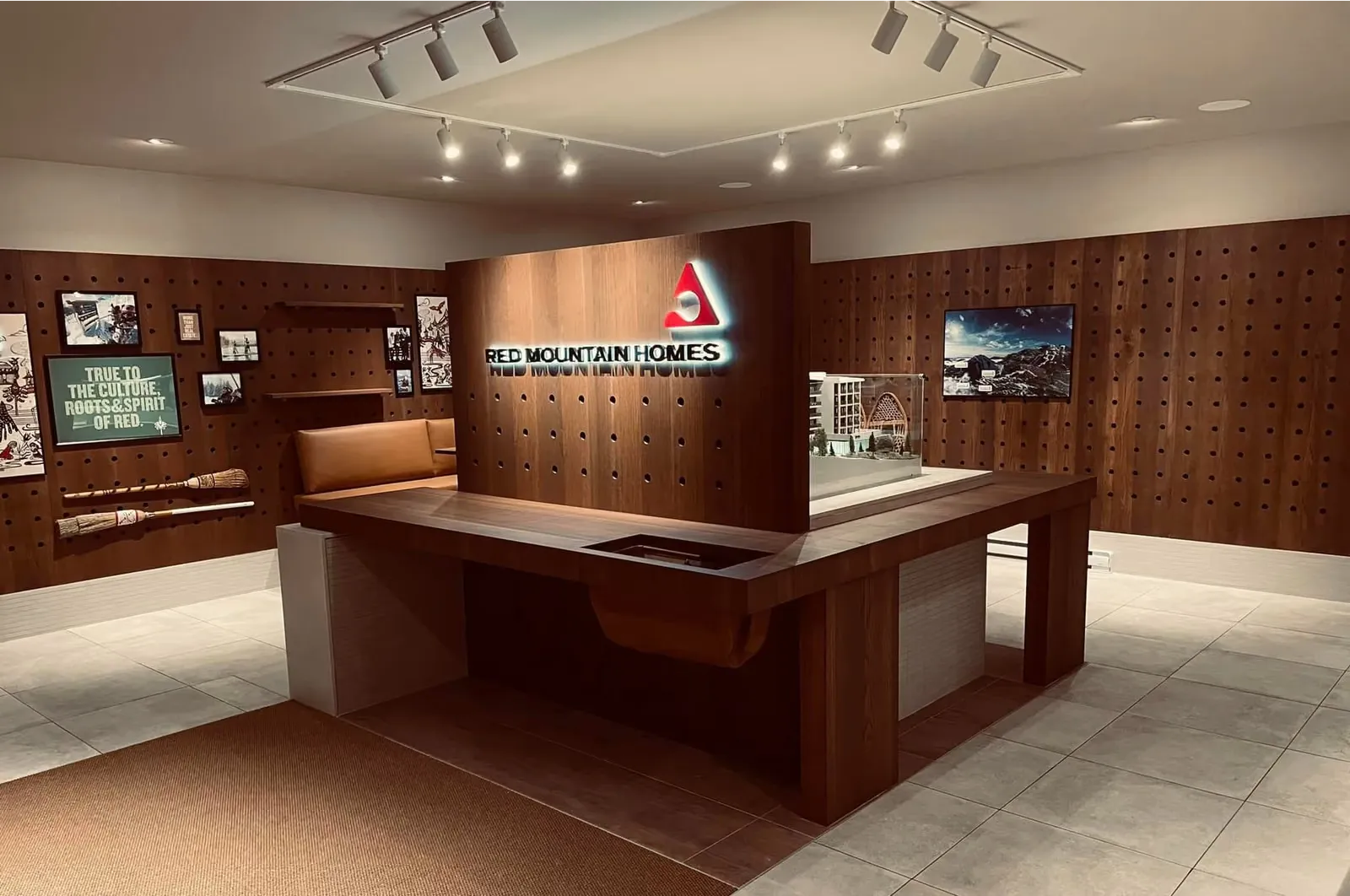 RED Mountain presentation centre display counter and walnut panelled wall